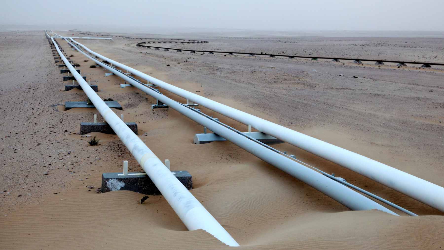 An oil pipeline infrastructure project running through the Canadian landscape toward coastal export terminals.