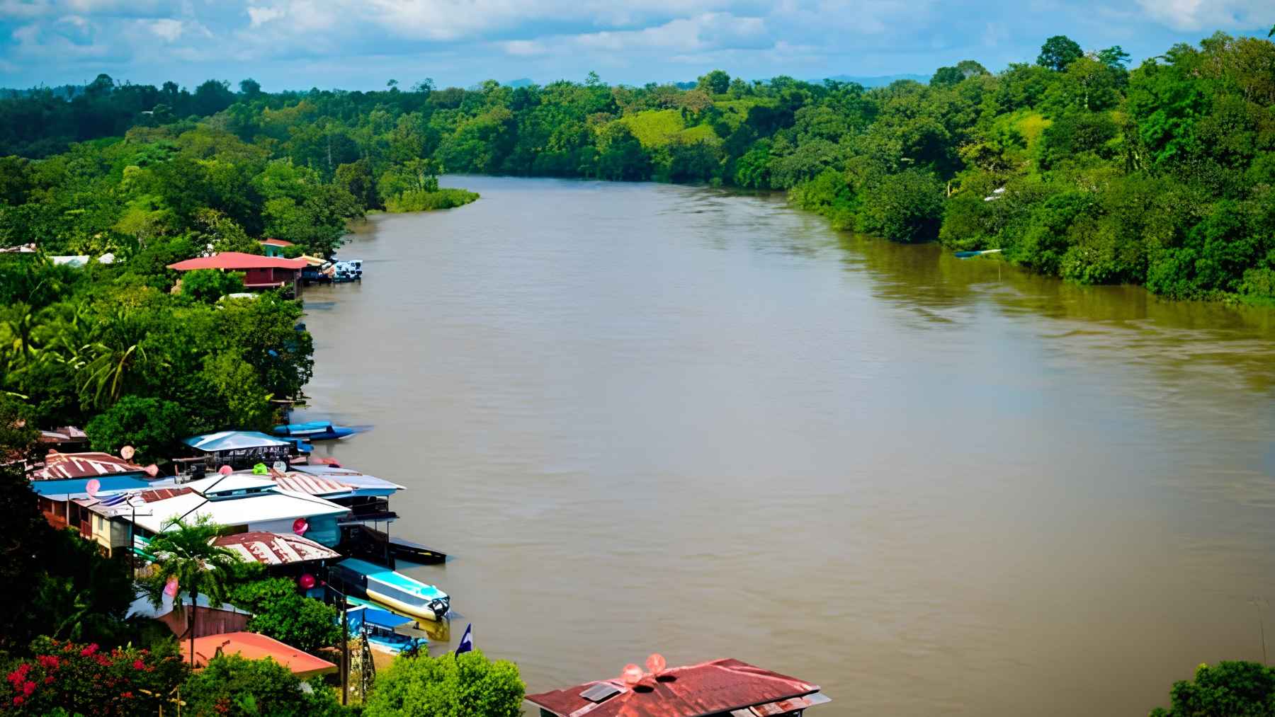 Deforested land and muddy pits caused by illegal gold mining operations in the Crucitas region of Costa Rica.