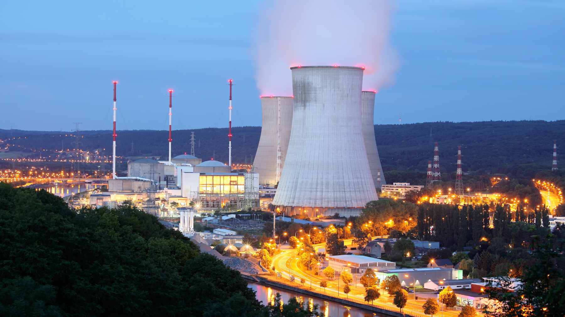 A diagram illustrating a modular nuclear reactor positioned one mile underground in a deep, narrow borehole, utilizing the surrounding rock for shielding.