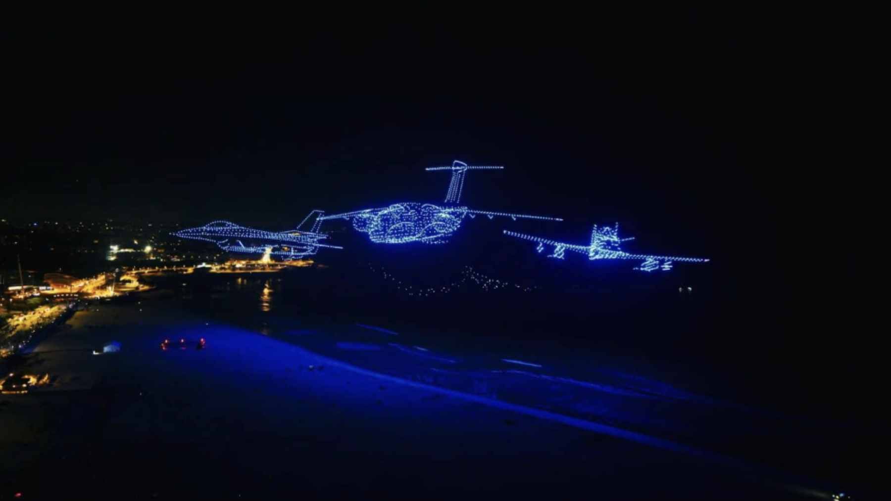 A night sky in Porto illuminated by 3,097 synchronized drones forming a large aerial message during the Air Invictus festival.