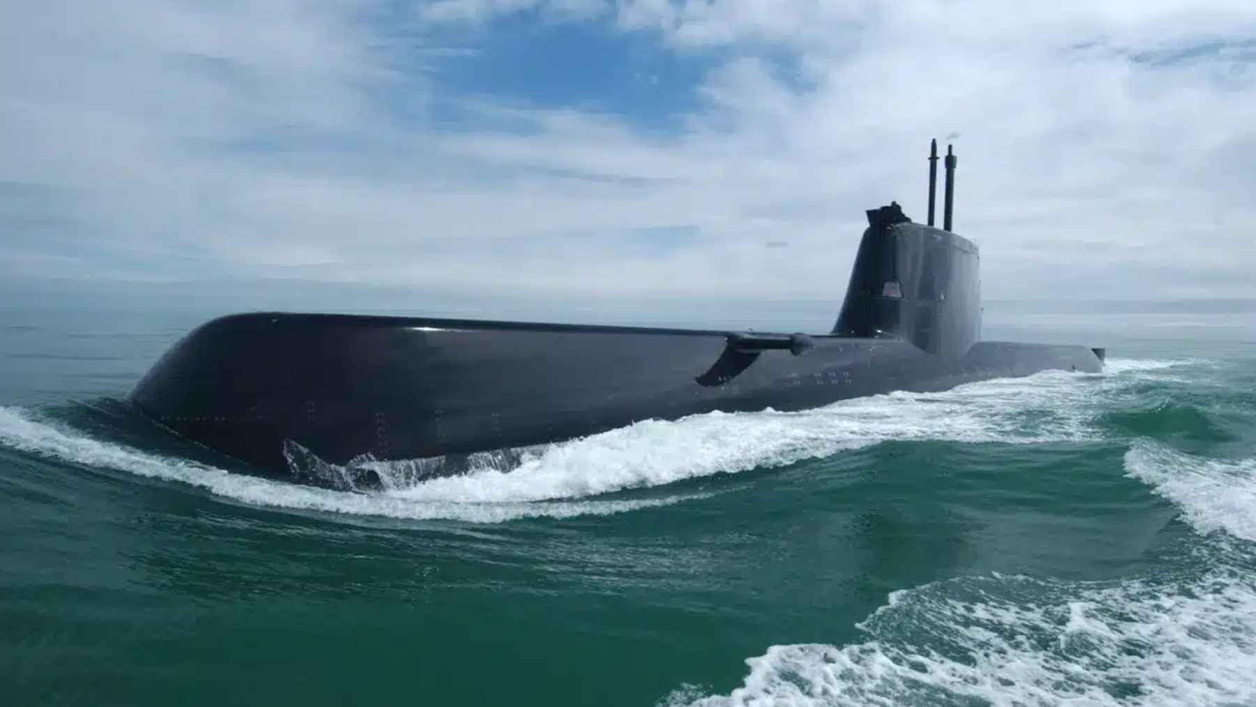 A German TKMS Type 212CD submarine navigating open polar waters to highlight Canada's new defense procurement strategy.