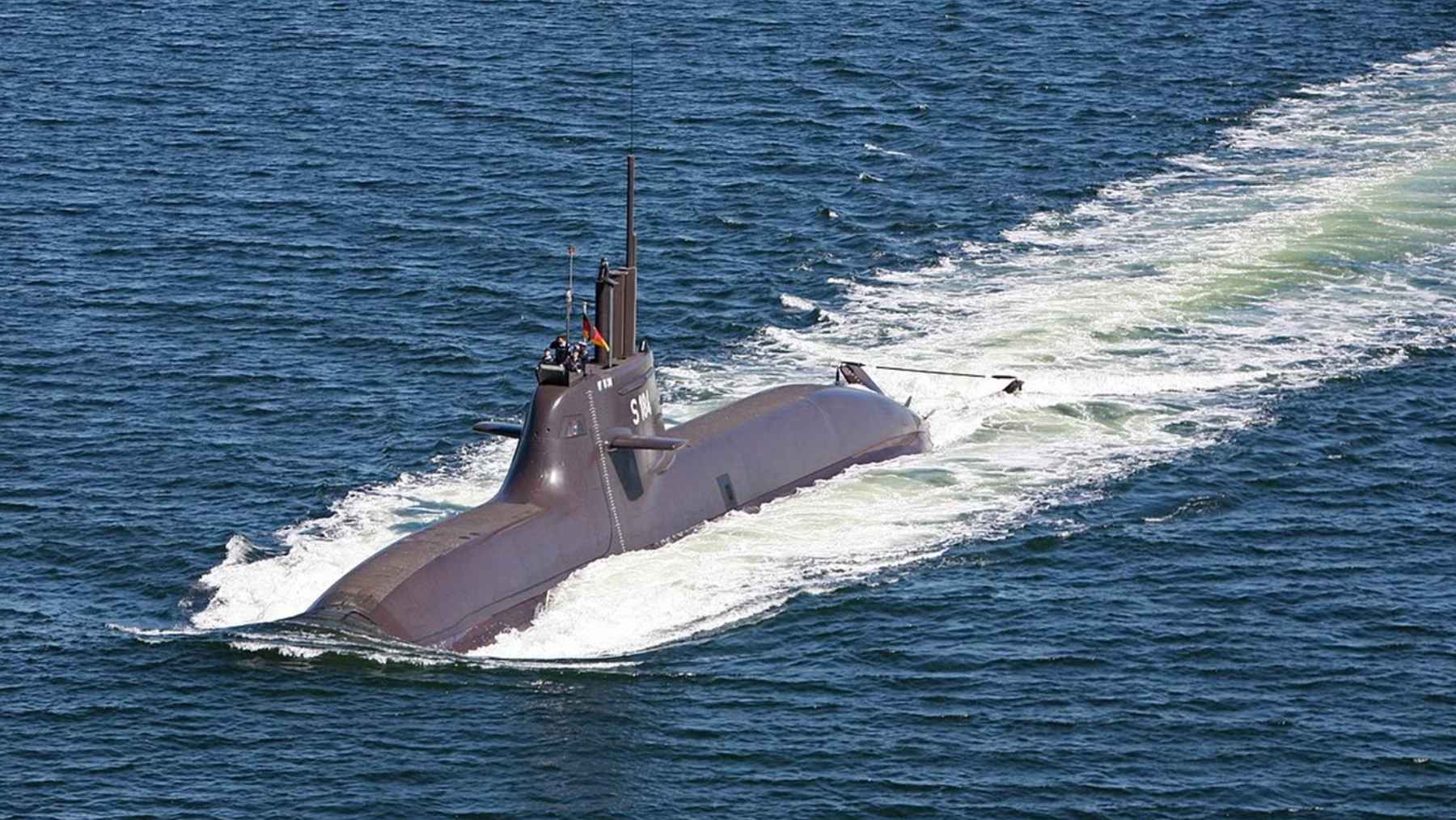 A modern Type 212CD submarine at sea, representing the historic multi-billion-dollar defense procurement agreement between Canada and German shipbuilder TKMS.