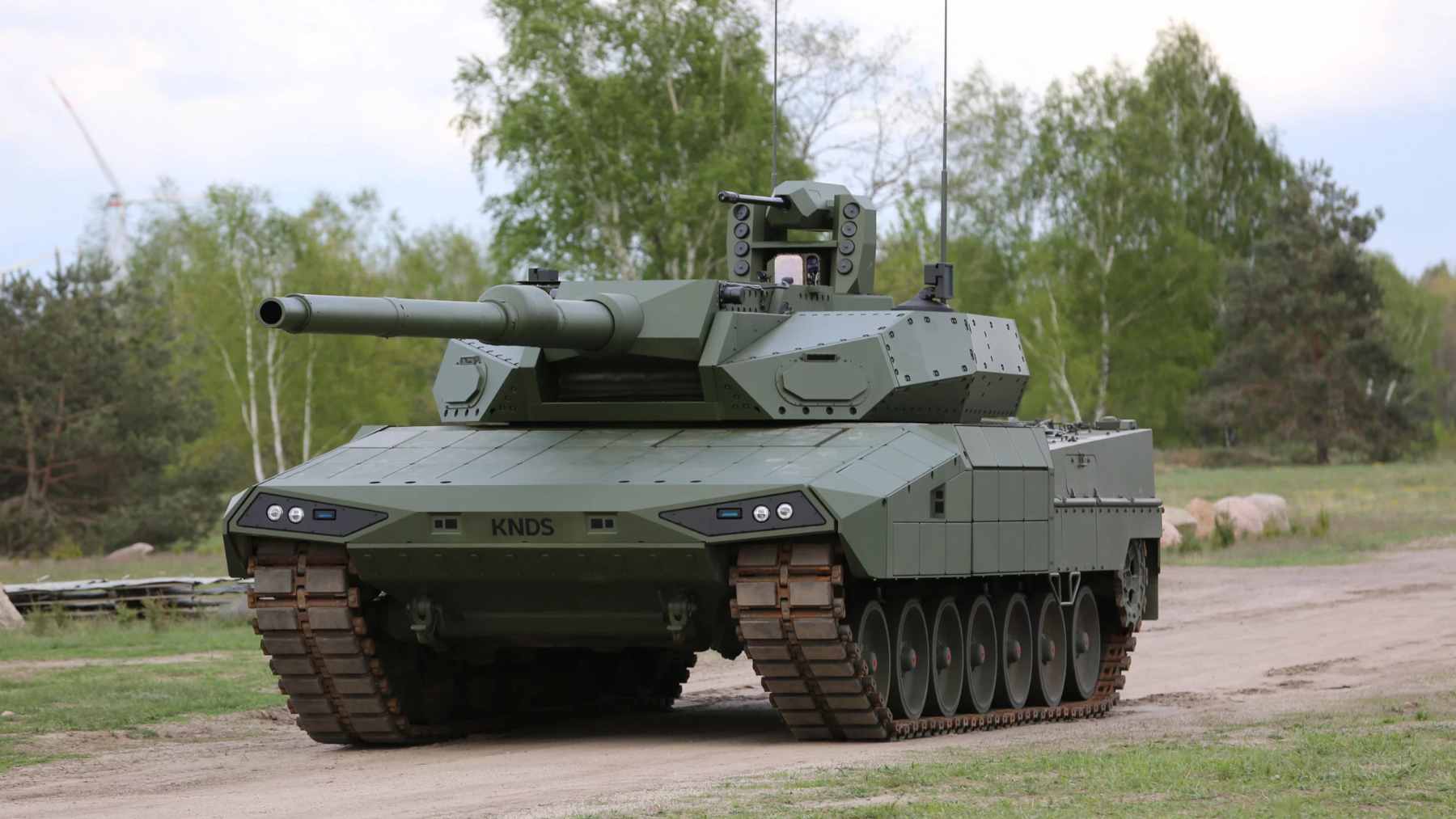 A Leopard 2 main battle tank on display, showcasing the heavy manufacturing capabilities of KNDS.