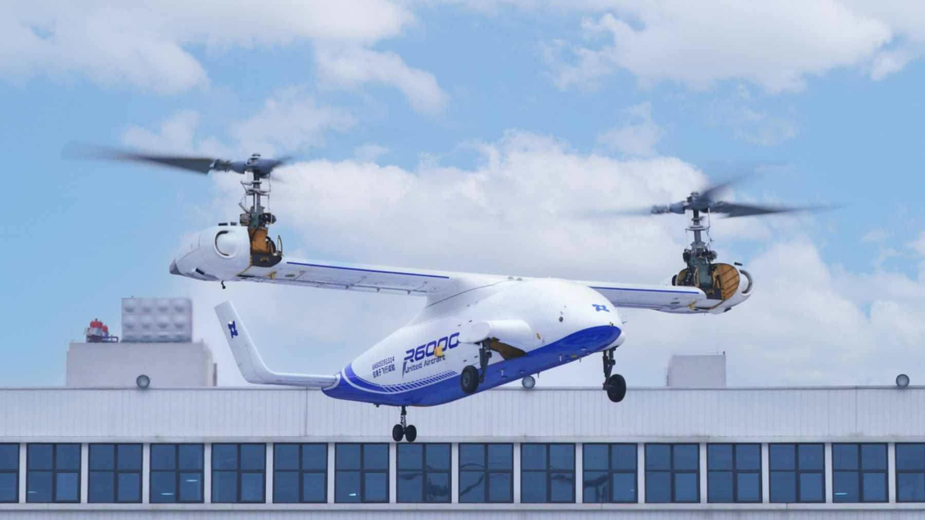 The R6000 autonomous tiltrotor drone performing a transition from hover to forward flight during untethered testing.
