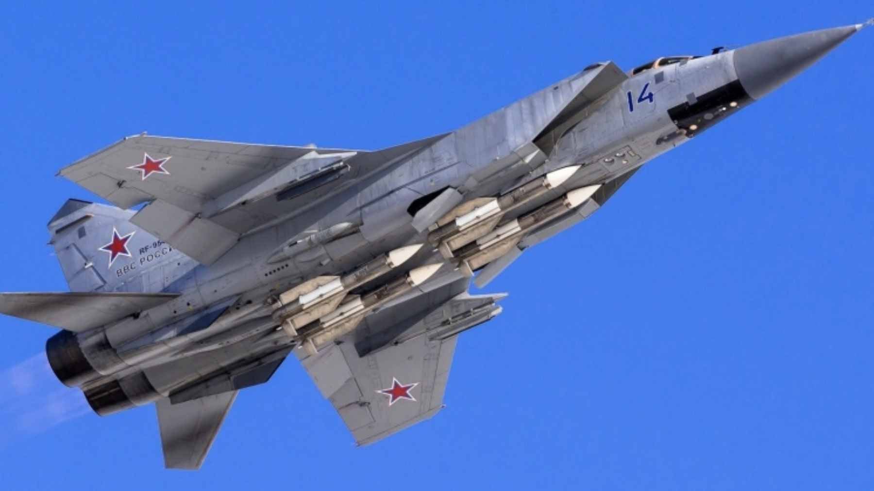 A Russian MiG-31BM Foxhound interceptor cruising over Arctic waters during a long-range strategic patrol.