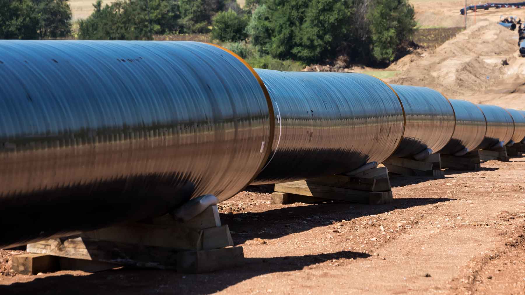 A digital map illustration showing a proposed oil pipeline route spanning across Canadian provinces from Alberta to Ontario.