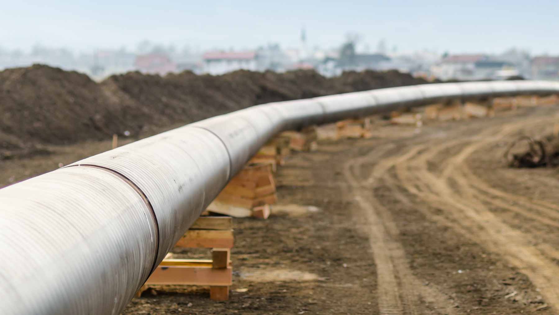A vast Canadian landscape mapped with a proposed cross-country oil pipeline route connecting Alberta to Ontario.