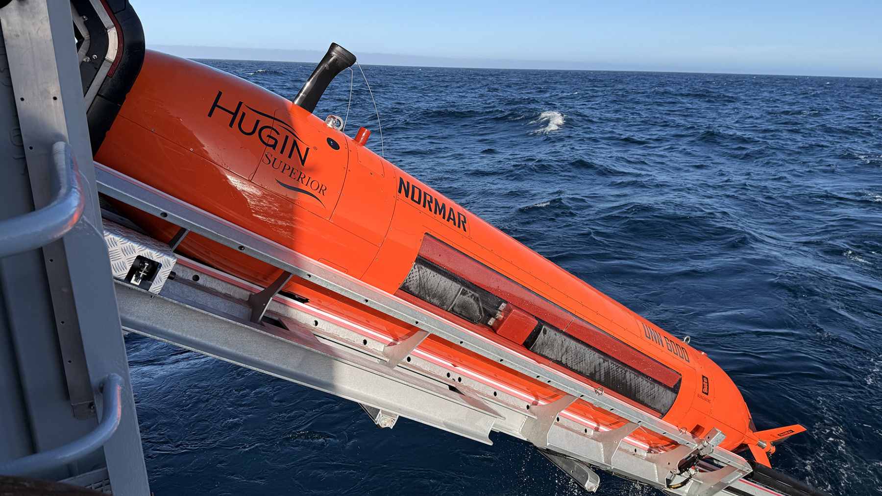The HUGIN Superior autonomous underwater vehicle being deployed into the Norwegian Sea for high-resolution seabed mapping.