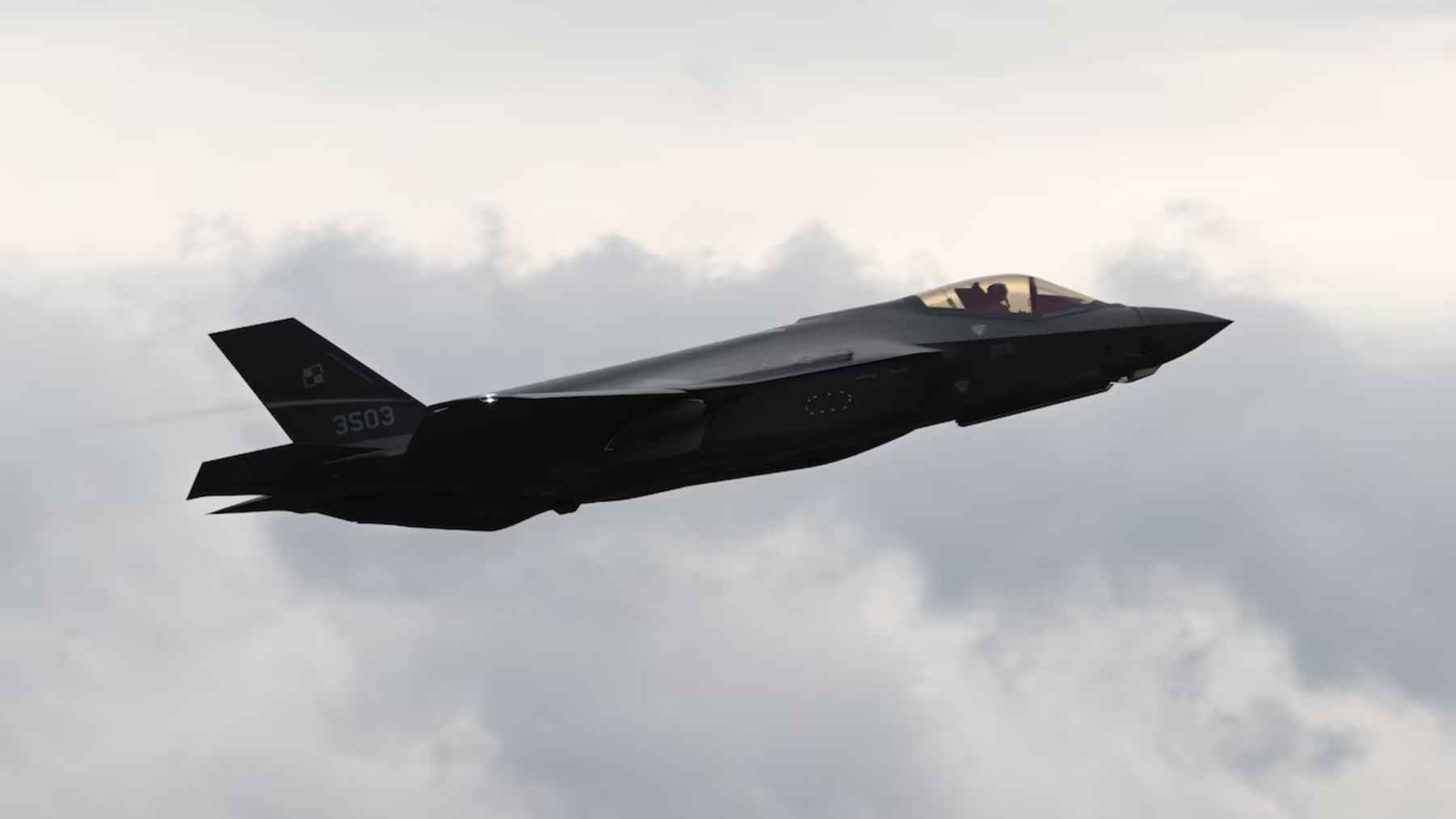 An F-35A Lightning II fighter jet on the flight line, representing the historic graduation of Poland's pilot training cycle at Ebbing Air National Guard Base in Arkansas.