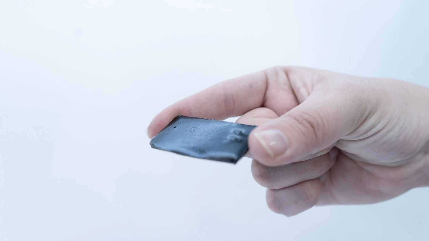 A laboratory setting showcasing advanced carbon materials and plasma technology used to develop radar-absorbing graphene coatings for aerospace applications.