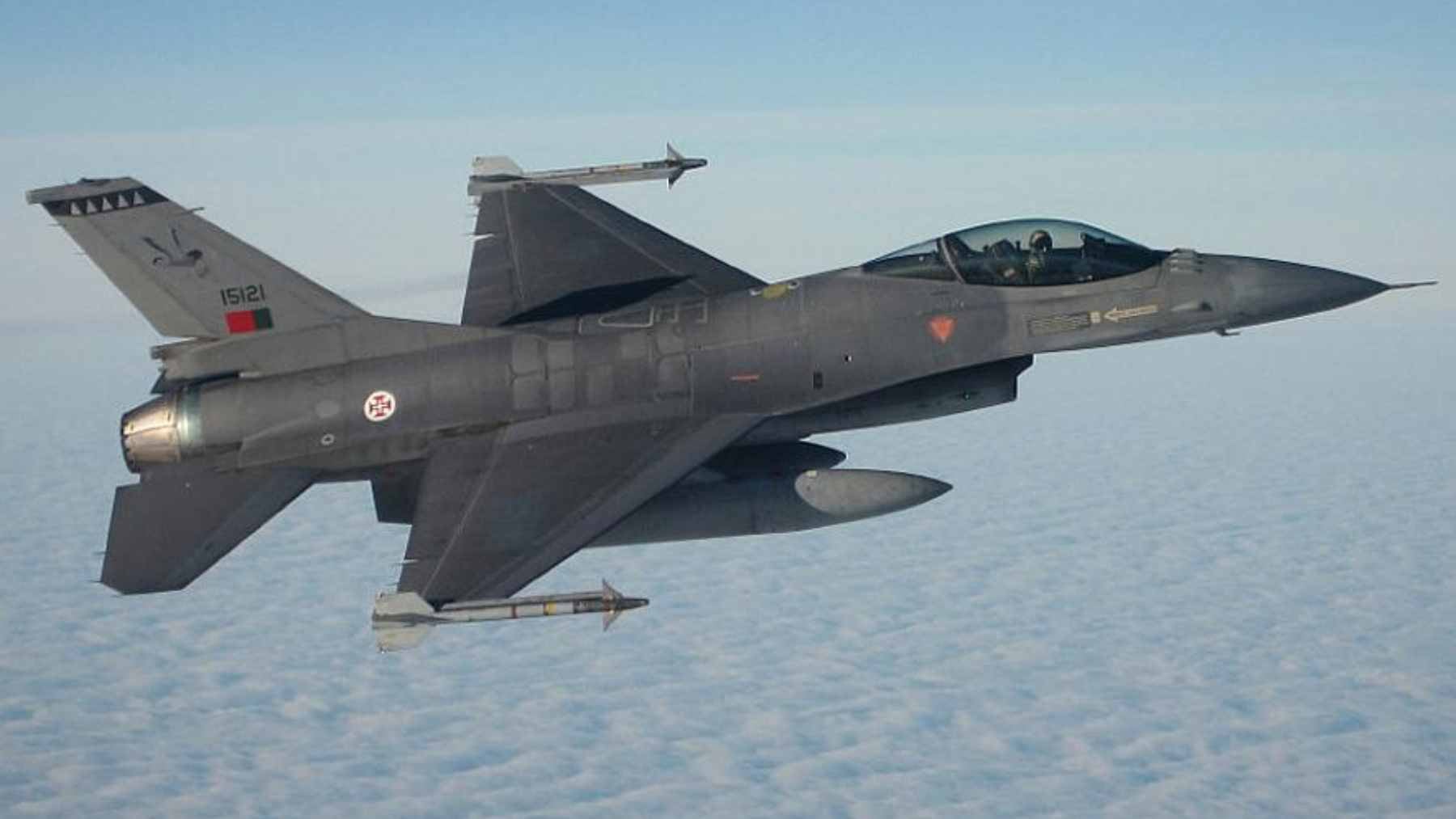 A Portuguese Air Force F-16 Fighting Falcon on static display in a public square in Viana do Castelo during the 74th-anniversary celebrations.