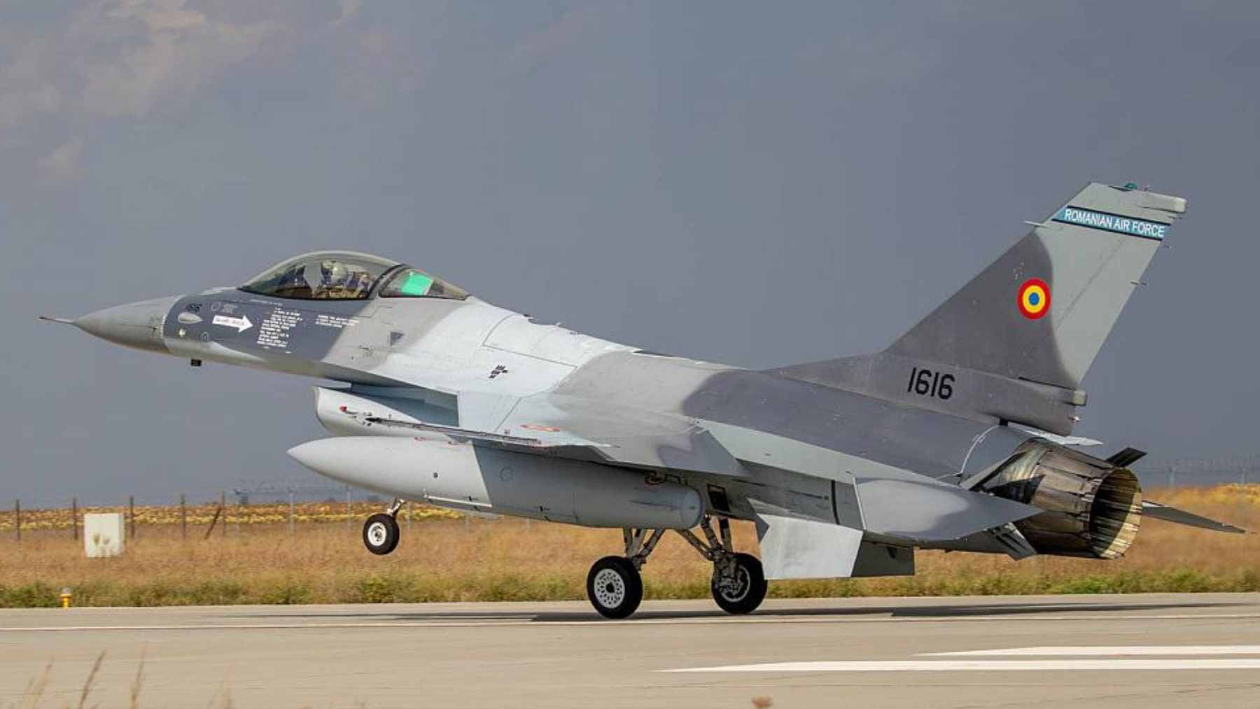 A Portuguese Air Force F-16 Fighting Falcon on static display in a public square in Viana do Castelo during the 74th-anniversary celebrations.