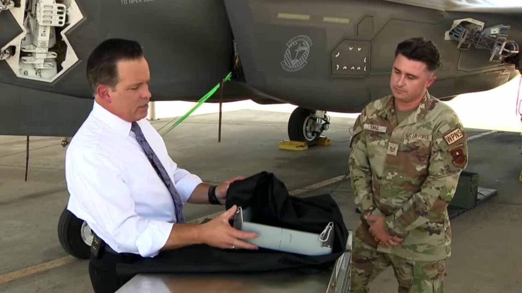 Two Air Force specialists 3D-printed a $100 attachment that could protect F-35s from $20 million in engine damage, and it's almost absurdly simple 1 Air Force weapons specialists demonstrating the 3D-printed Project ZACH brass-catching attachment on an F-35 ammunition loading system.