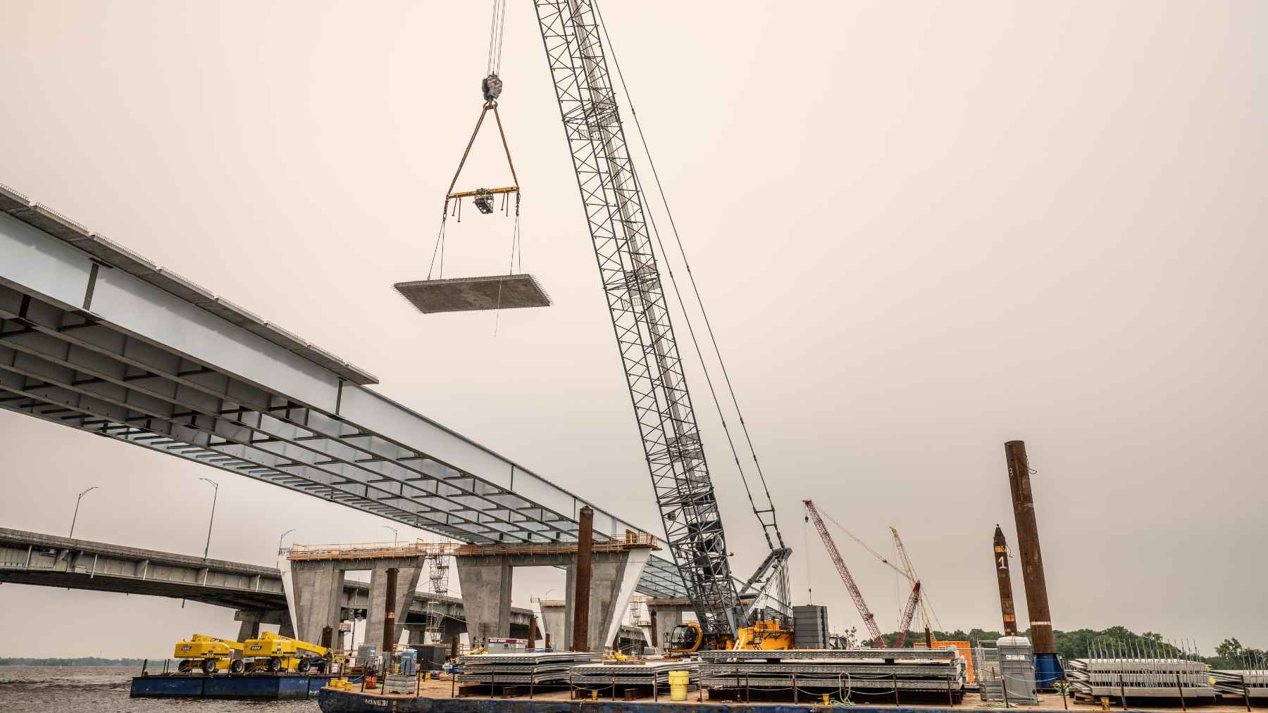Quebec has now finished all 46 piers of the new Île-aux-Tourtes Bridge, one of its biggest projects 1 Construction work and concrete piers of the new Île-aux-Tourtes Bridge project spanning across the water in Quebec.