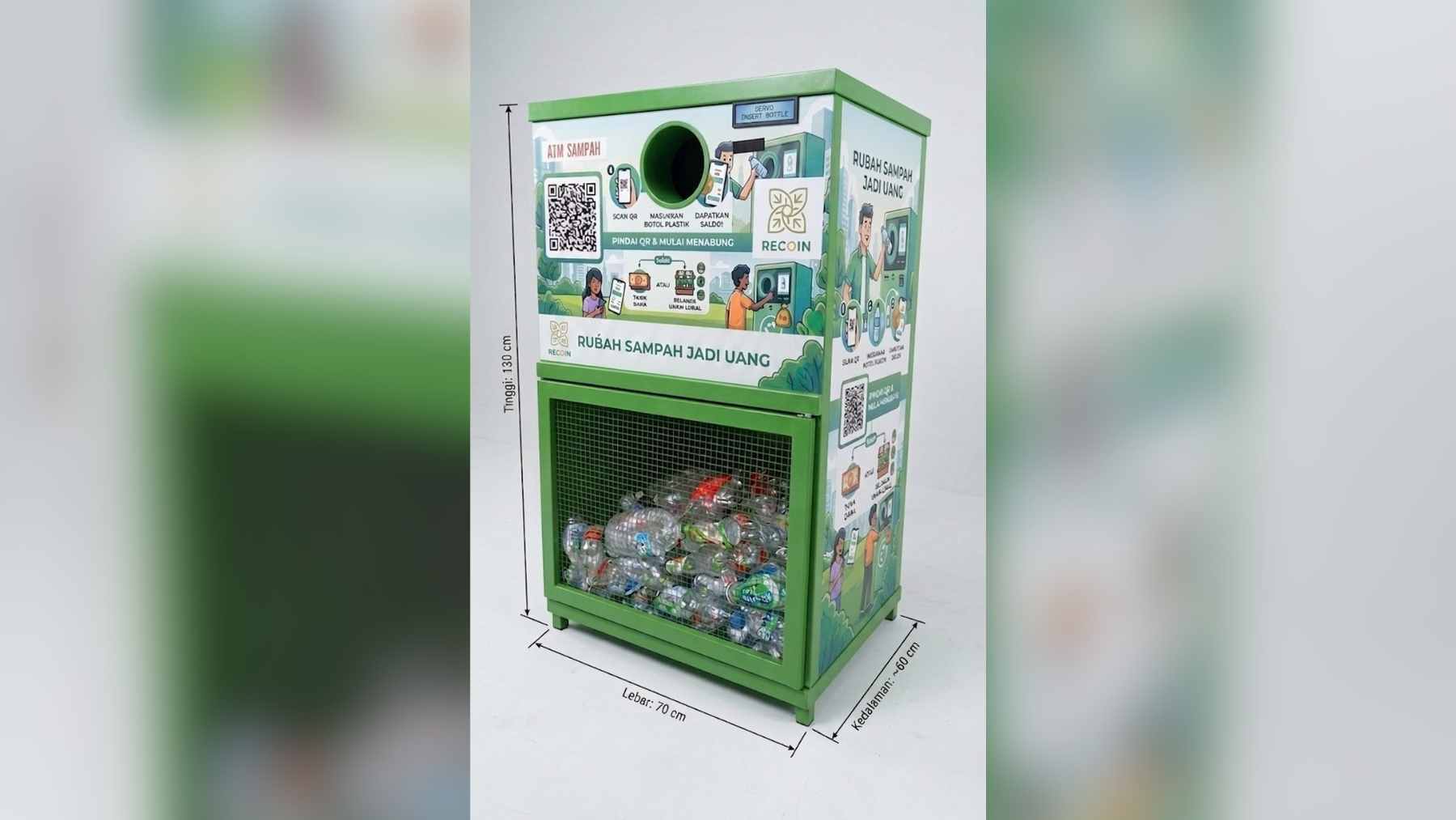 A close-up of the RECOIN reverse vending machine in Magelang, Indonesia, showing a user scanning a QR code to deposit a plastic bottle.