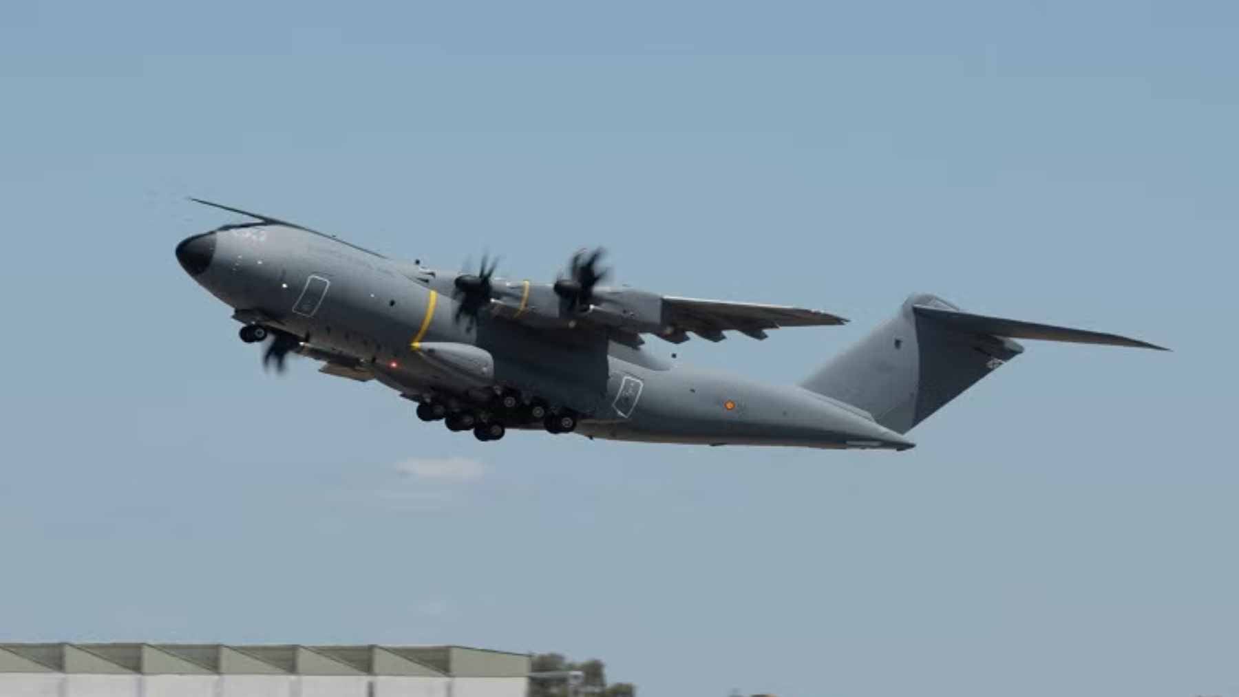 An Airbus A400M military transport aircraft flying in the sky during a flight demonstration.