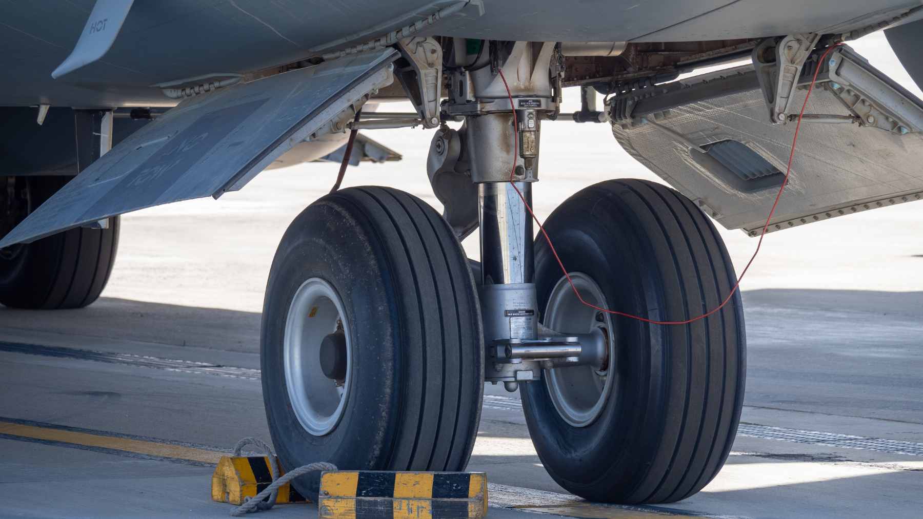 A high-tech carbon-fiber aircraft landing gear component designed to act as a structural battery.