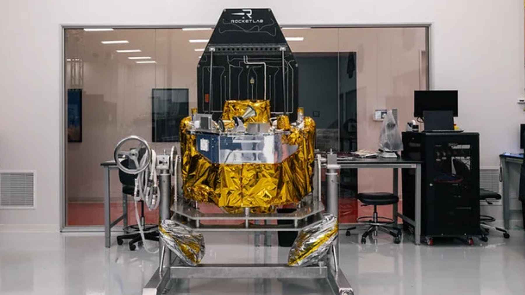 A conceptual digital illustration of a commercial satellite performing an orbital rendezvous and proximity operation in space.