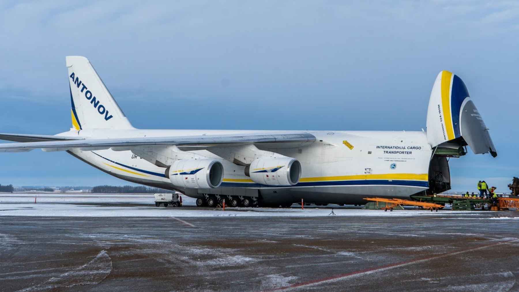 The massive Antonov AN-124 cargo aircraft parked on the tarmac at Melbourne Orlando International Airport.