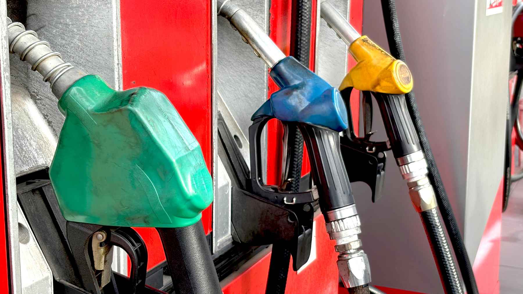 Argentina's gas stations aren't switching fuels by choice: falling demand is quietly pushing them off CNG 1 A gas station fueling island in Argentina featuring compressed natural gas and liquid fuel dispensers.