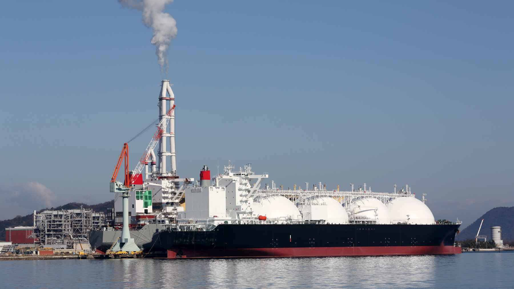 Banning Russian gas won't free Europe: a top Spanish import hub warns it just hands power to the US 2 A liquefied natural gas terminal and storage tanks at a port in Spain, representing the ongoing debate over Russian gas bans and energy security.