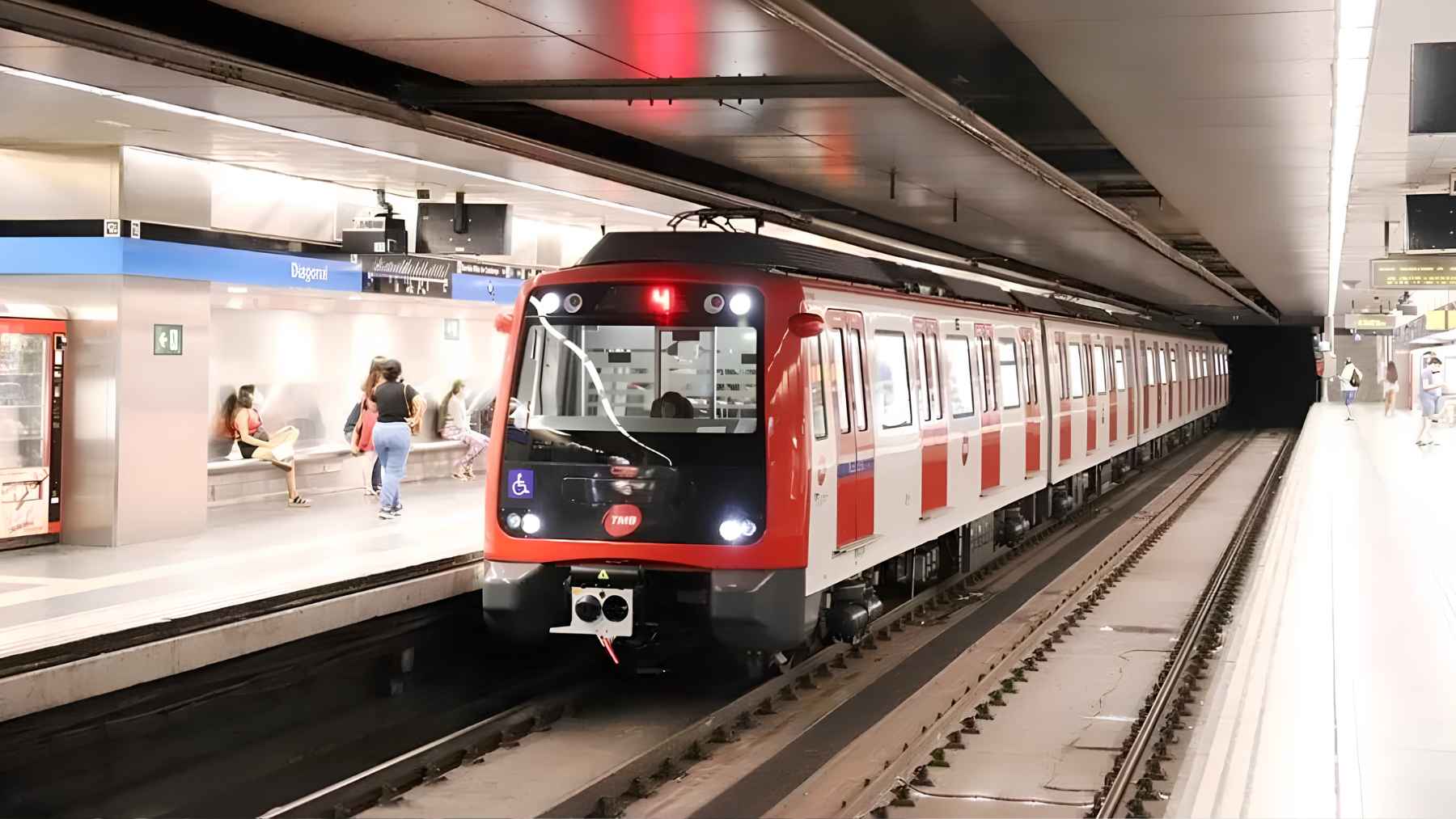Busy platform at the historic Plaça de Catalunya metro station in Barcelona, representing urban public transportation.