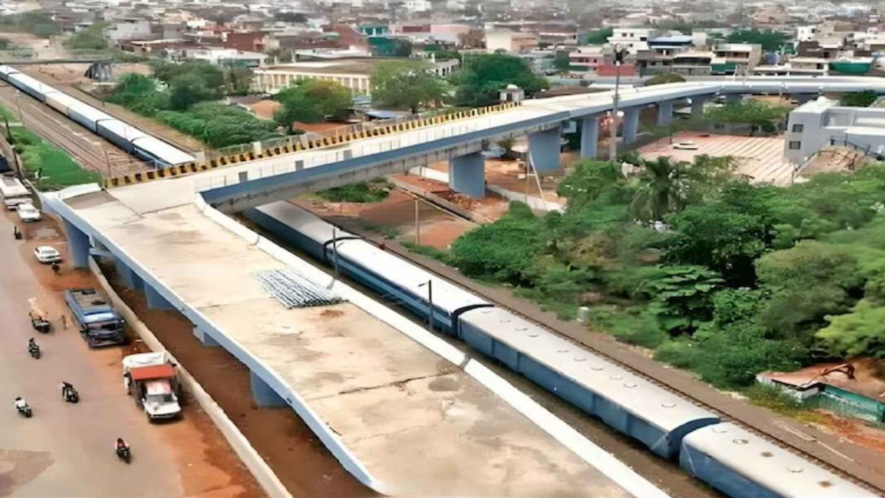 A high-angle view of the Aishbagh Rail Over Bridge in Bhopal, highlighting its sharp curve and approach layout.
