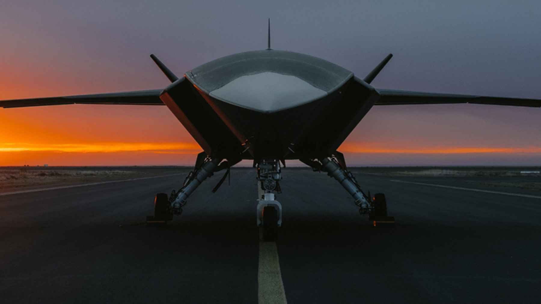 Boeing's MQ-28 Ghost Bat uncrewed tactical aircraft displayed on the tarmac at an international airshow.