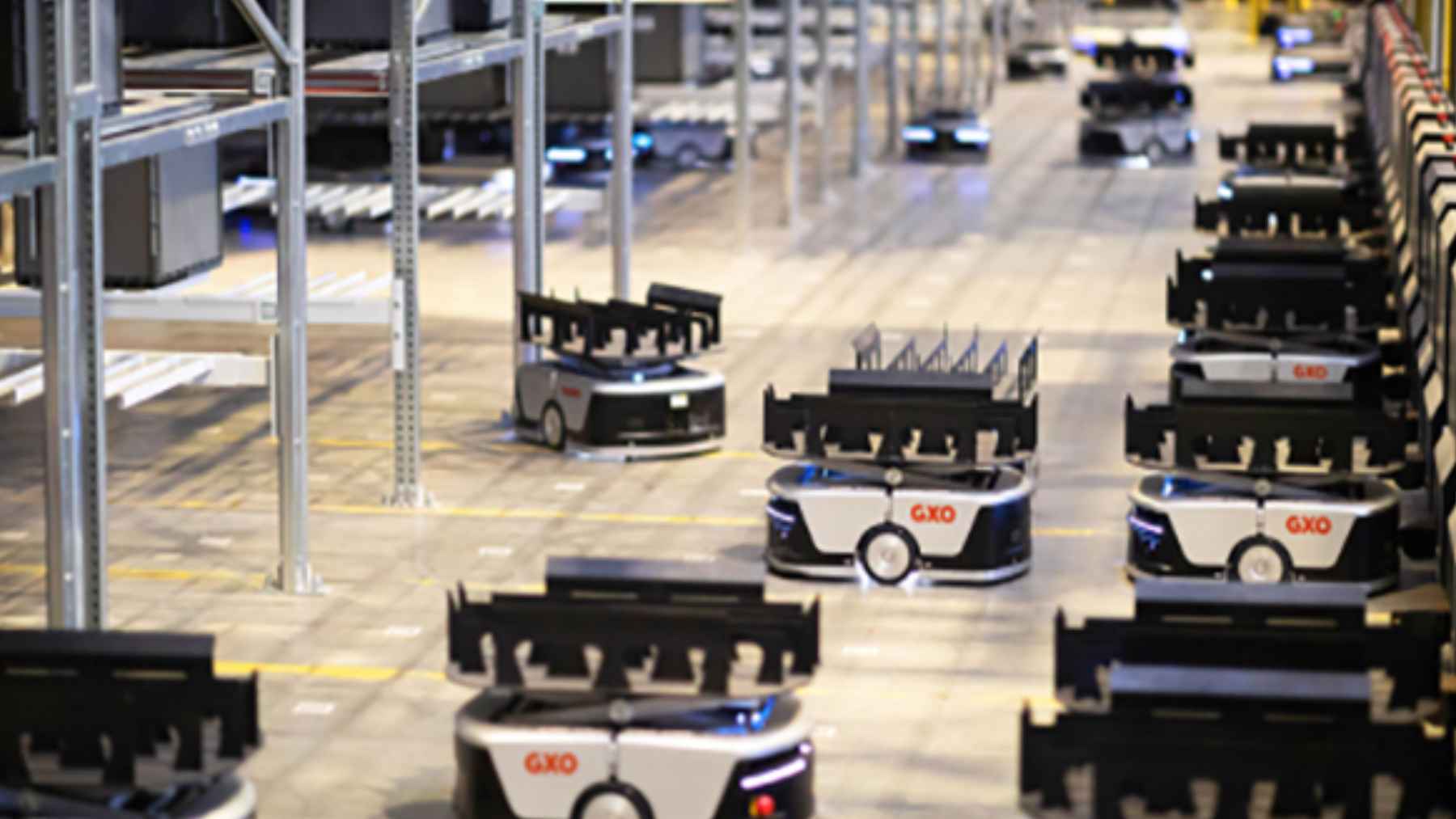 A Chinese robot army is now moving into UK supermarkets, filling a labor gap retailers can't close 1 Automated mobile robots operating inside a modern UK retail distribution warehouse.
