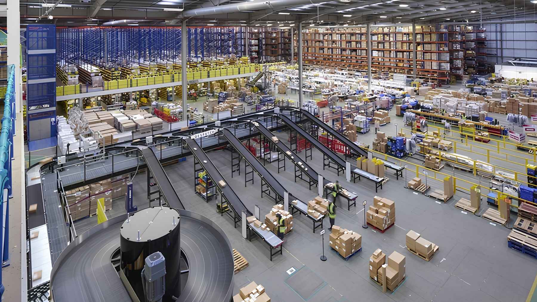 Automated mobile robots operating inside a modern UK retail distribution warehouse.