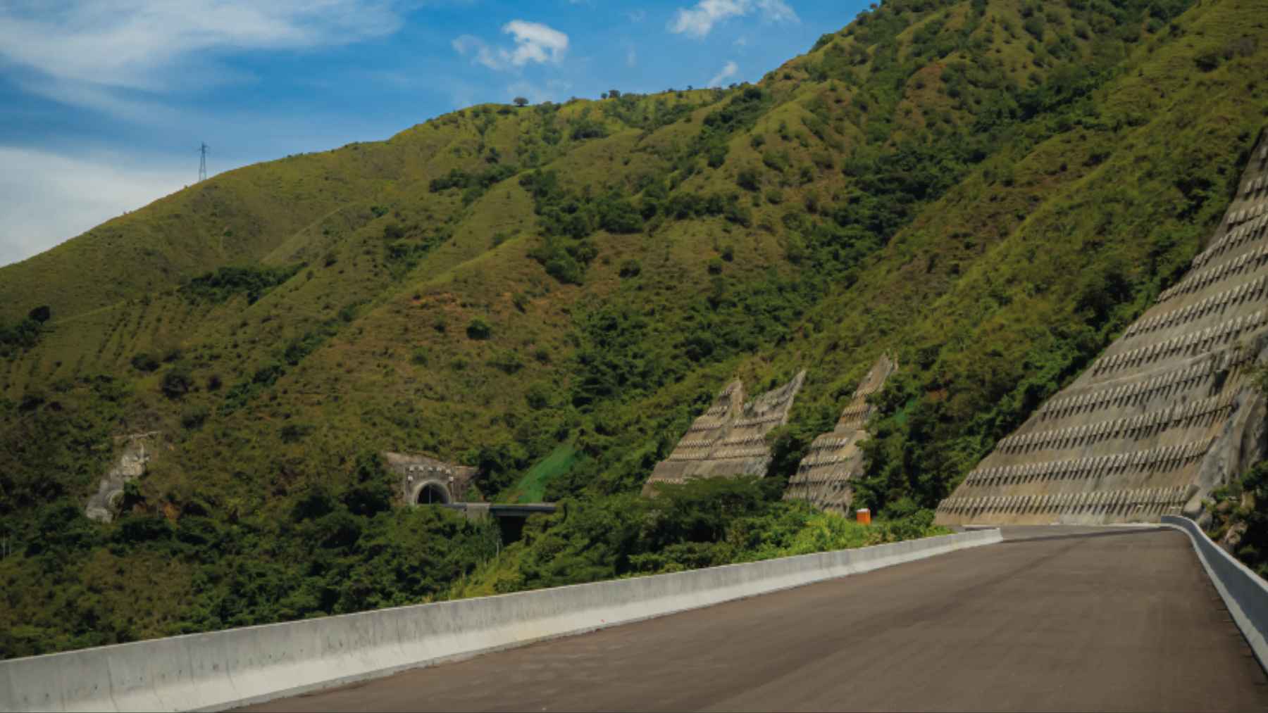The grand entrance of the Túnel del Toyo project in Colombia, representing advanced infrastructure and engineering.