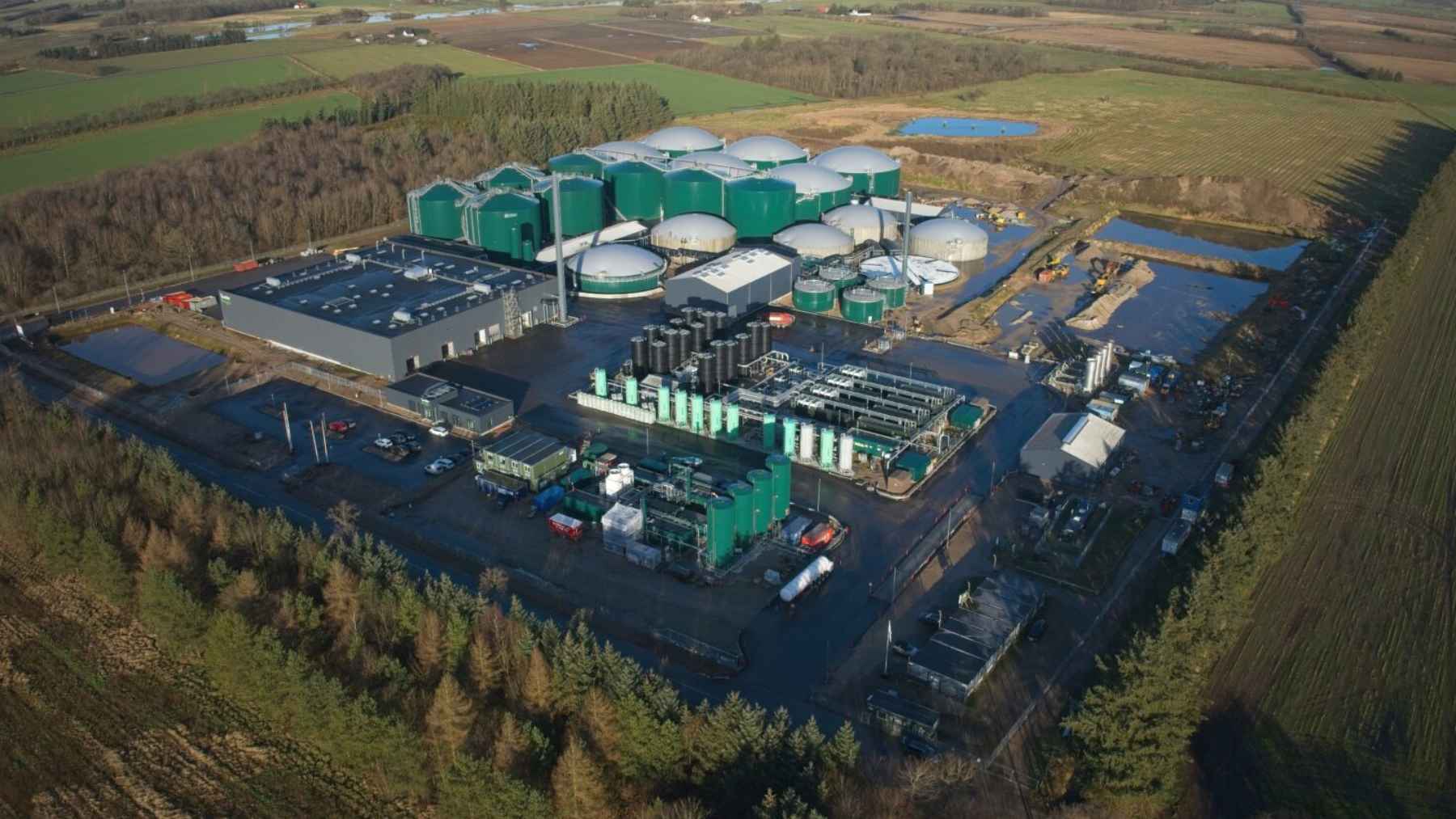 A modern industrial biogas facility in Denmark processing agricultural waste into renewable green energy.