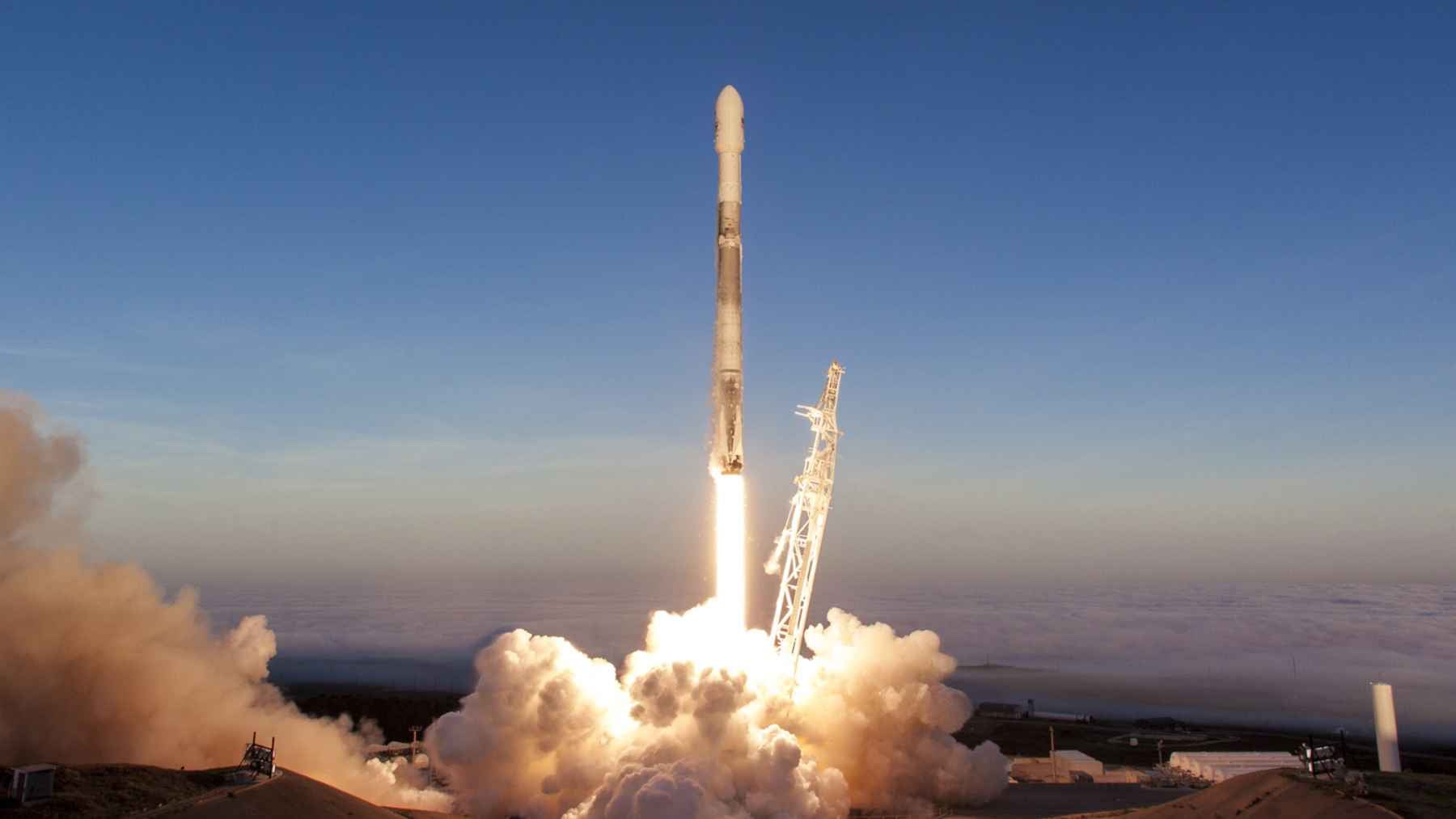 A SpaceX Starship rocket on the launch pad, representing commercial aerospace expansion, artificial intelligence, and high-value market valuation.