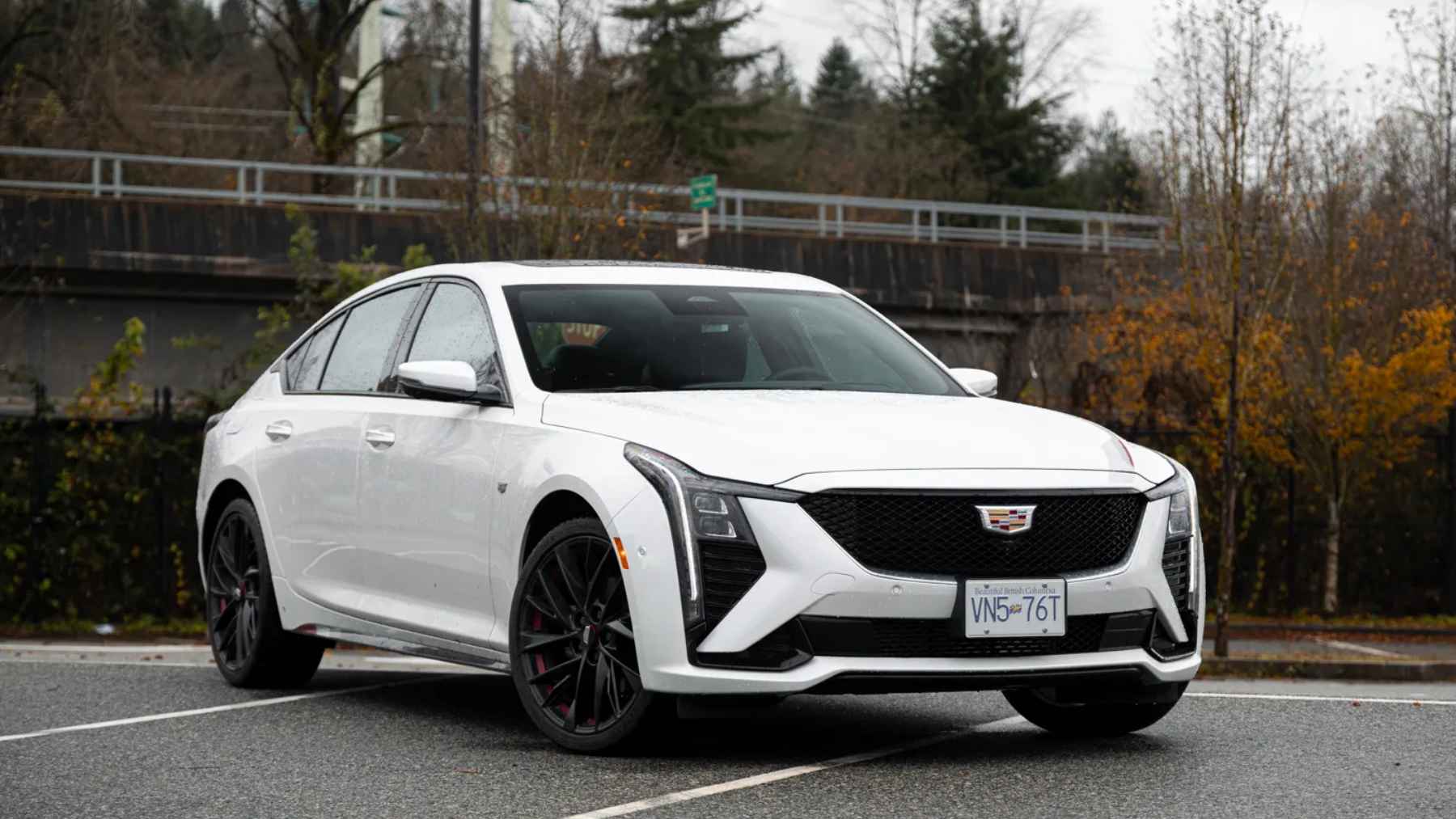 A luxury Cadillac vehicle parked outside, representing General Motors' expanding vehicle lineup and gasoline strategy.