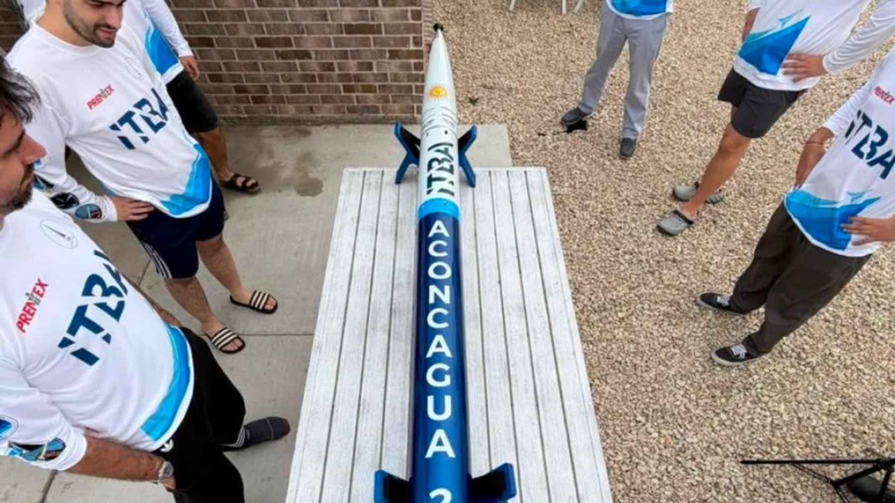 The ITBA rocketry team posing with their award-winning Aconcagua rocket at an international engineering competition.