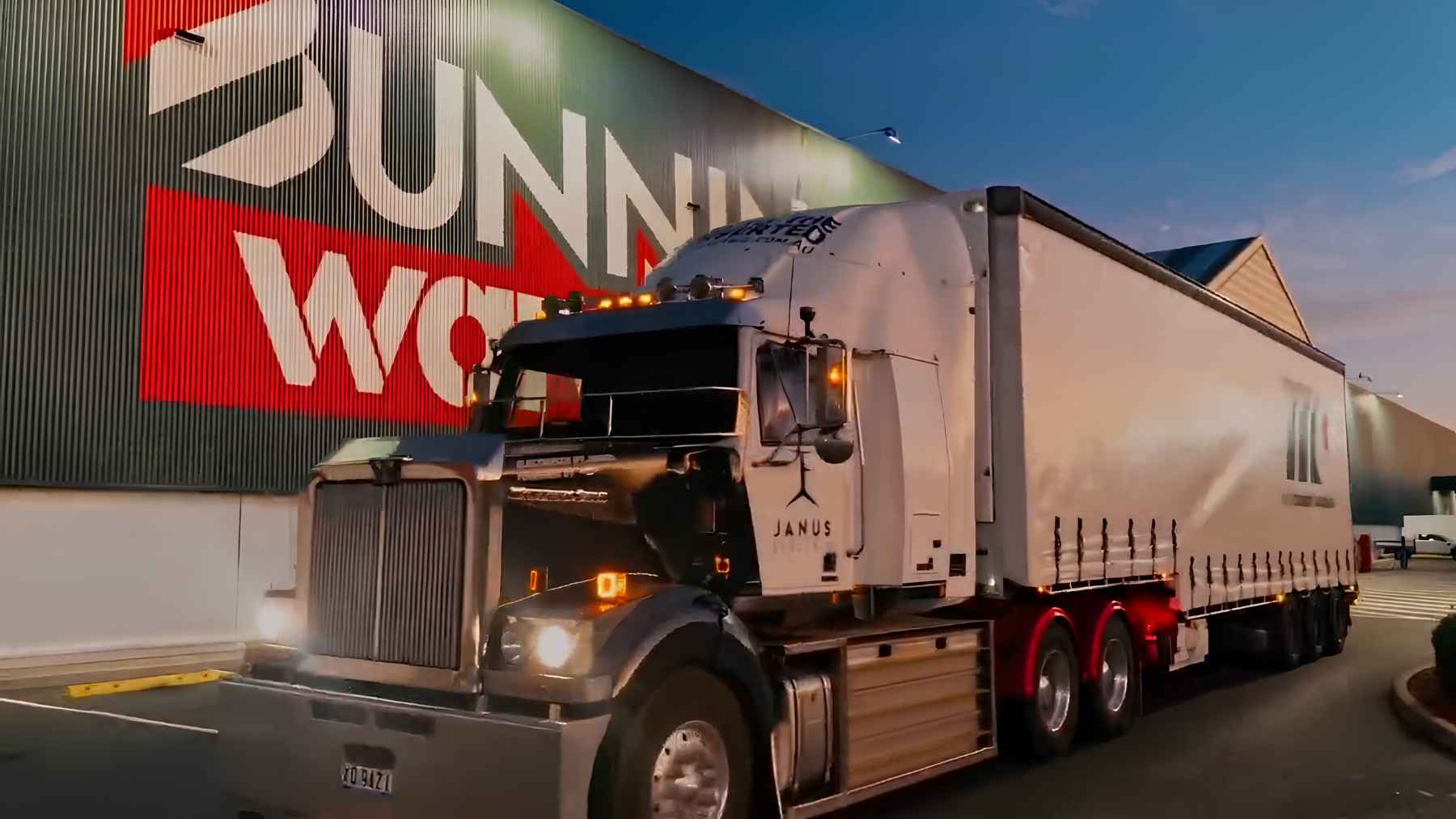 The US is converting diesel trucks to run electric with 480 horsepower and a four-minute recharge, and the battery is not bolted on 2 A heavy-duty Class 8 truck undergoing an electric conversion at a Janus Charge & Change station, featuring a swappable battery pack system.