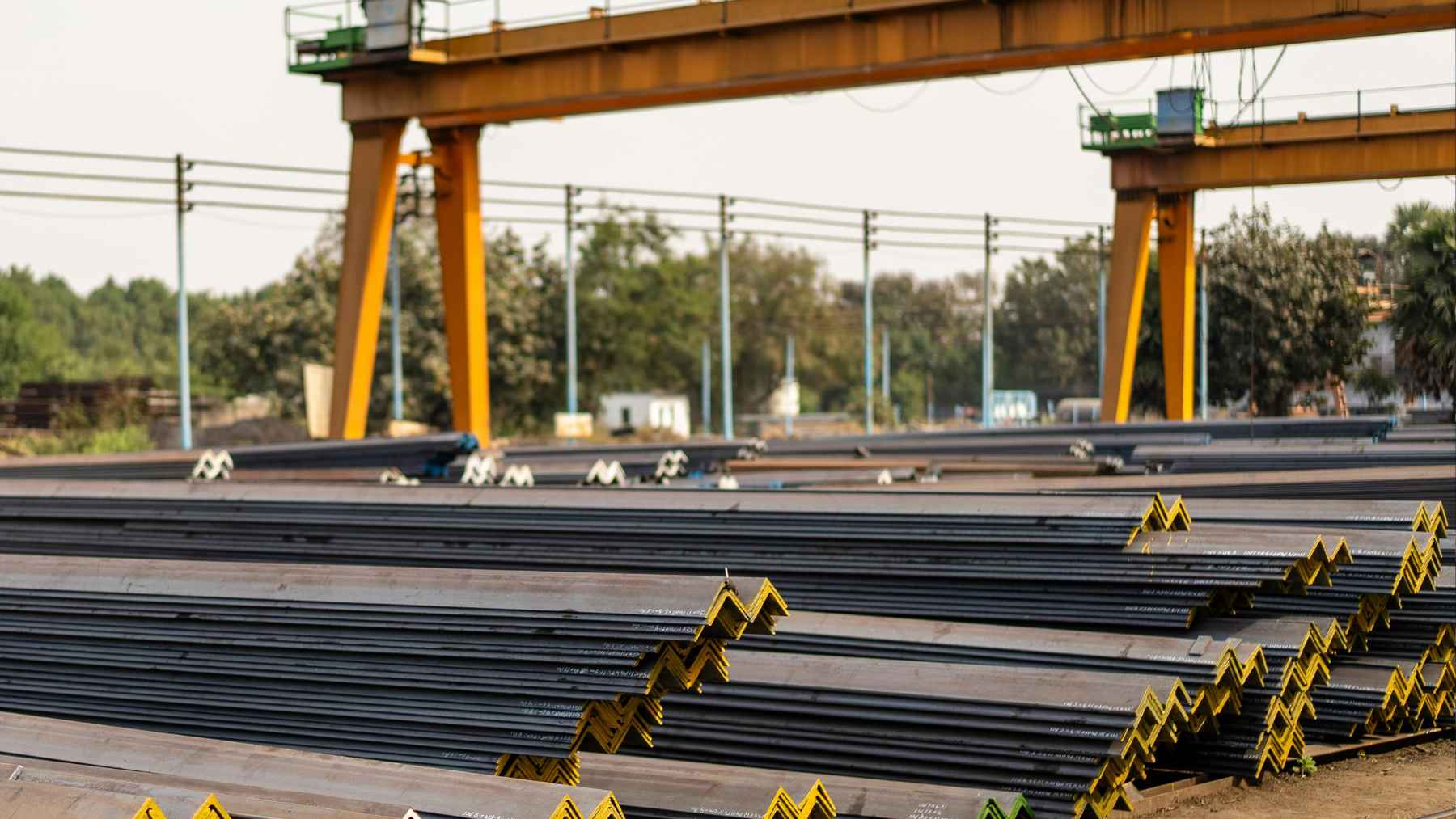 Heavy construction machinery at work on the JSW Rayalaseema Steel plant site in Kadapa, India.