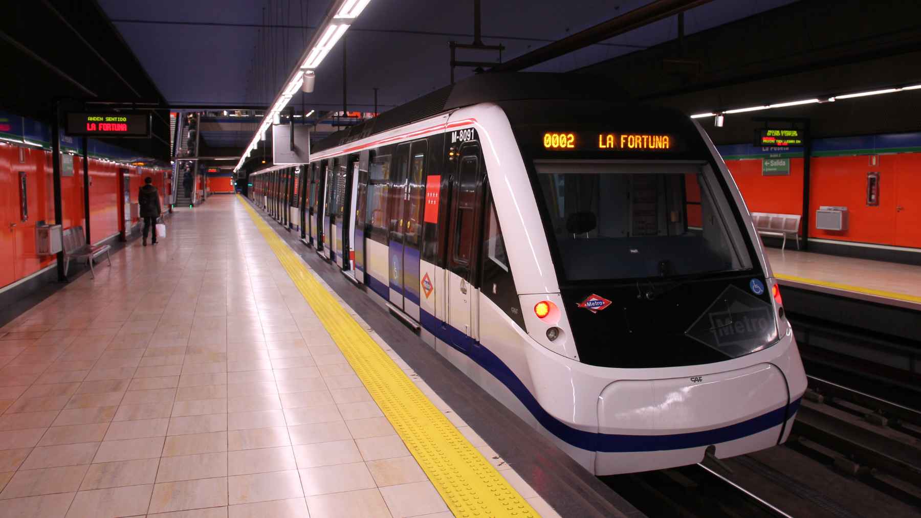 A Madrid Metro train and platform representing the major Line 11 infrastructure expansion connecting southern and northern areas of the city.