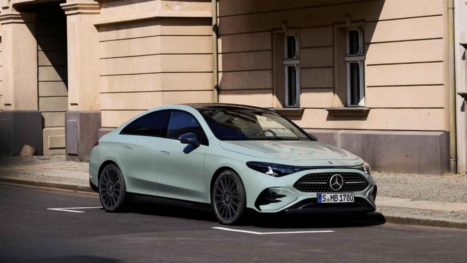 A modern hybrid engine under the hood of a luxury Mercedes vehicle, highlighting international powertrain manufacturing.