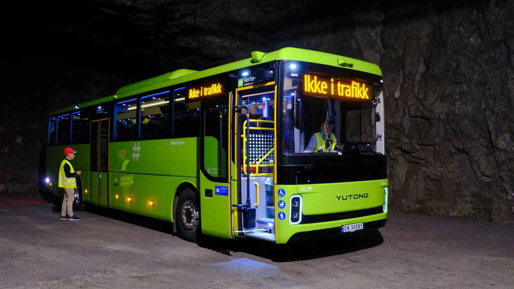An electric transit bus parked inside a secure testing facility during cybersecurity and telematics evaluations.