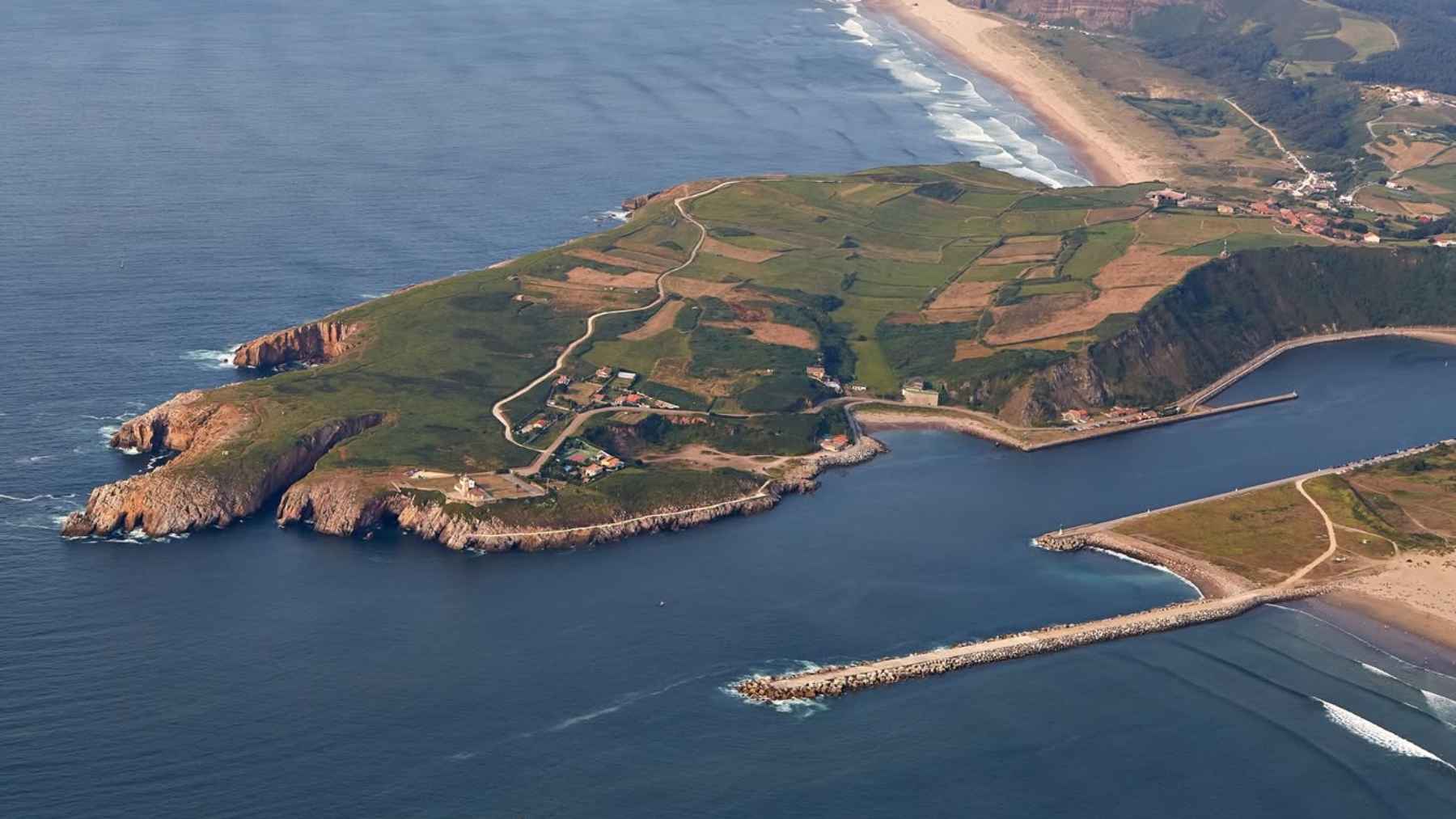 Coastal breakwaters and rock revetments protecting the shoreline at the Port of Avilés in northern Spain.