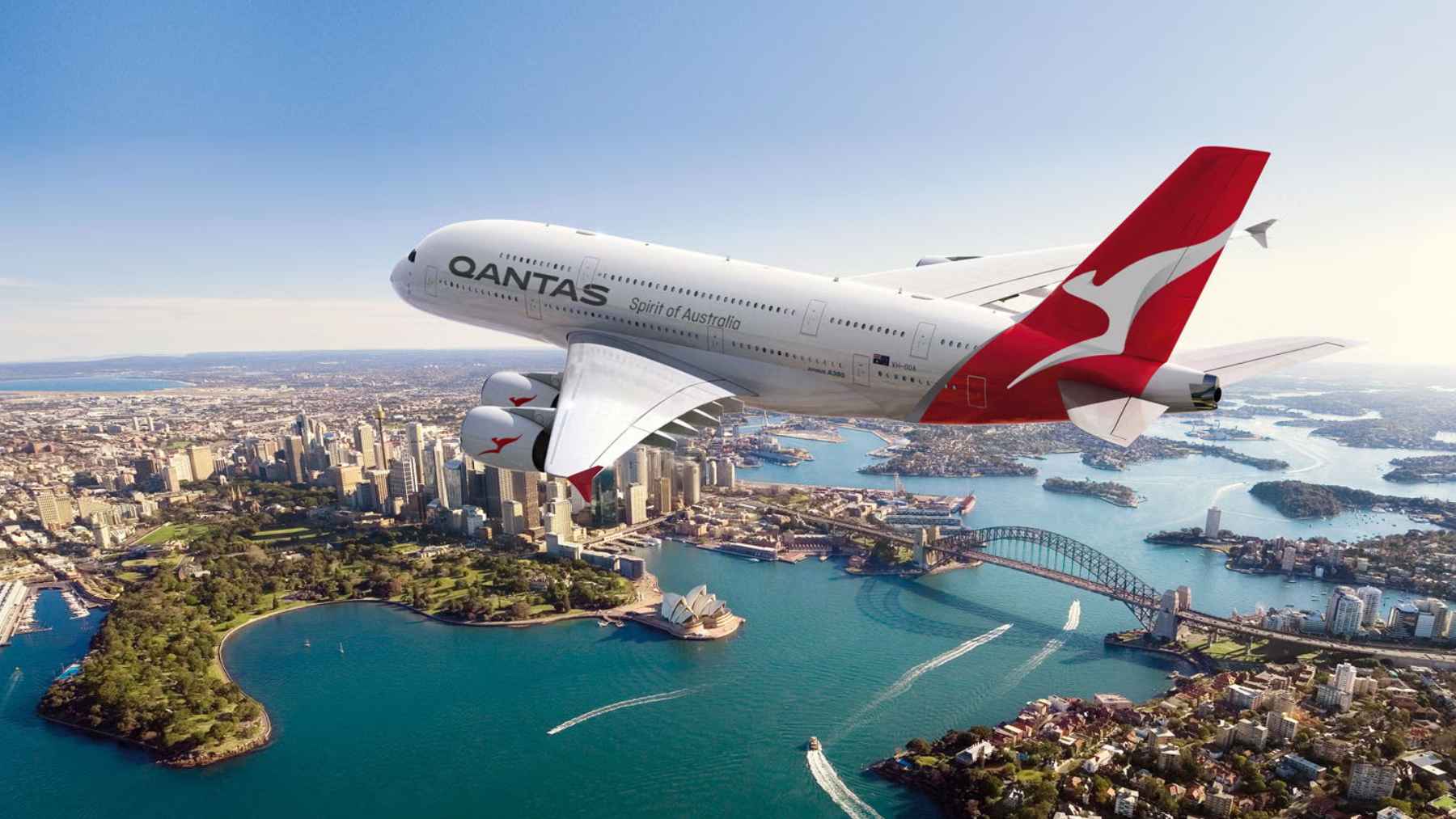 A Qantas Airbus A380 widebody passenger aircraft parked at an airport gate after completing its return to service.
