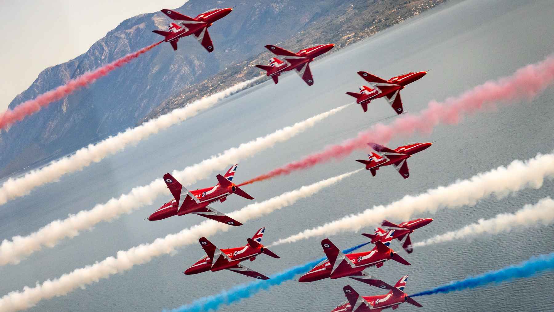 Red Arrows Hawk jets parked on the tarmac at Canadian Forces Base Goose Bay during weather delays.