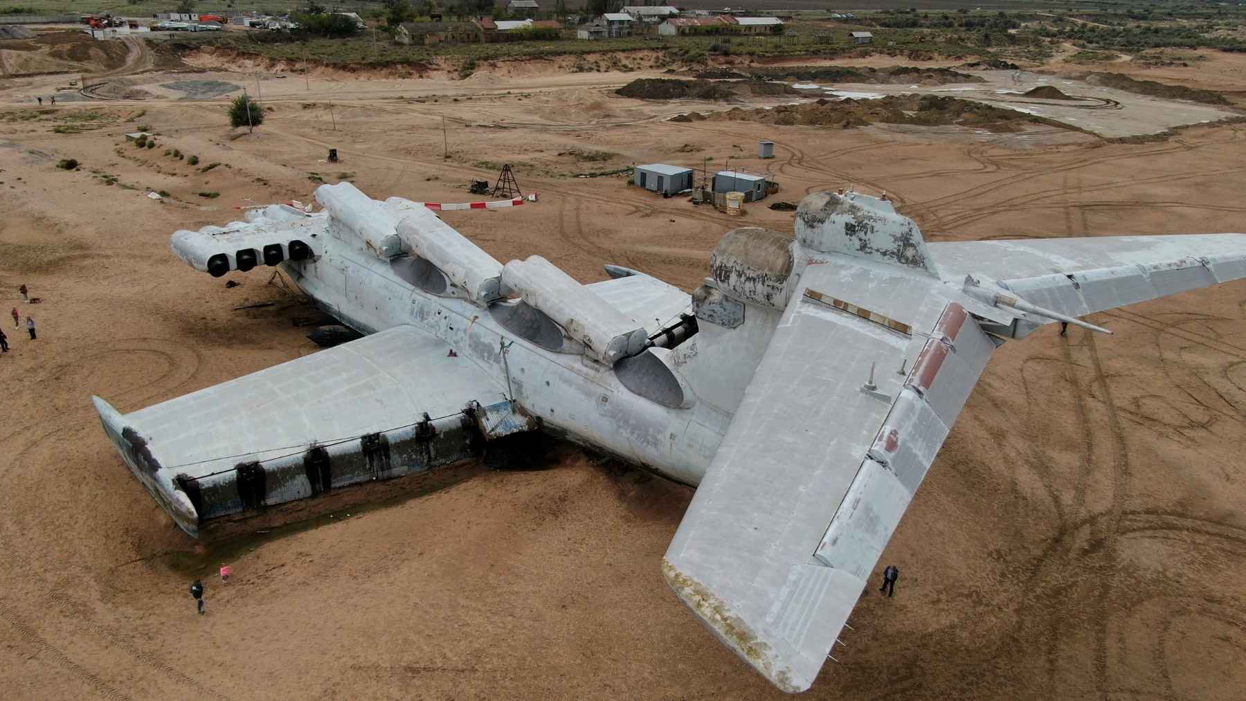 Retired aircraft sitting in desert boneyards now generate $80 million in parts as airlines wait 12 years for new planes 2 Rows of retired commercial airliners parked in an arid desert boneyard, representing aircraft component recycling and spare parts storage.