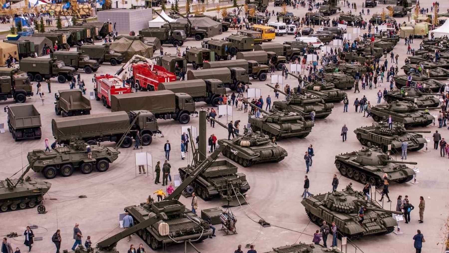 Visitors exploring military tanks and hardware on display at Russia's Patriot Park.