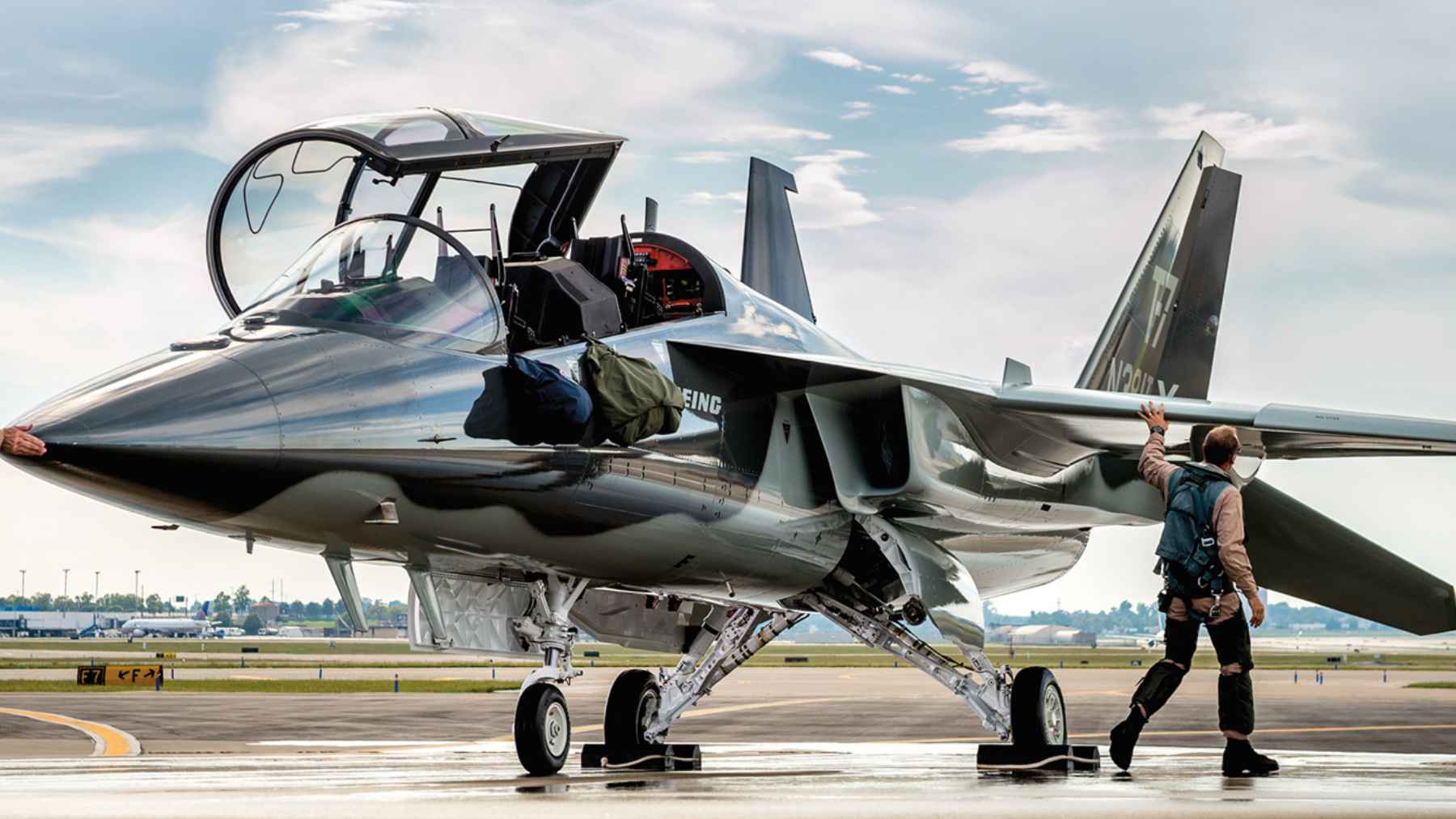A Boeing T-7A Red Hawk advanced jet trainer aircraft in flight, representing modern military pilot training systems.