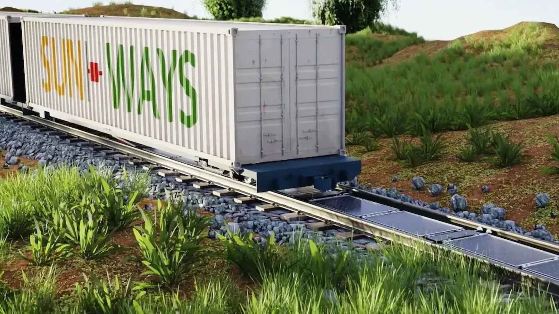 Solar panels installed between active railway tracks in Switzerland, representing the Sun-Ways innovative solar energy project.