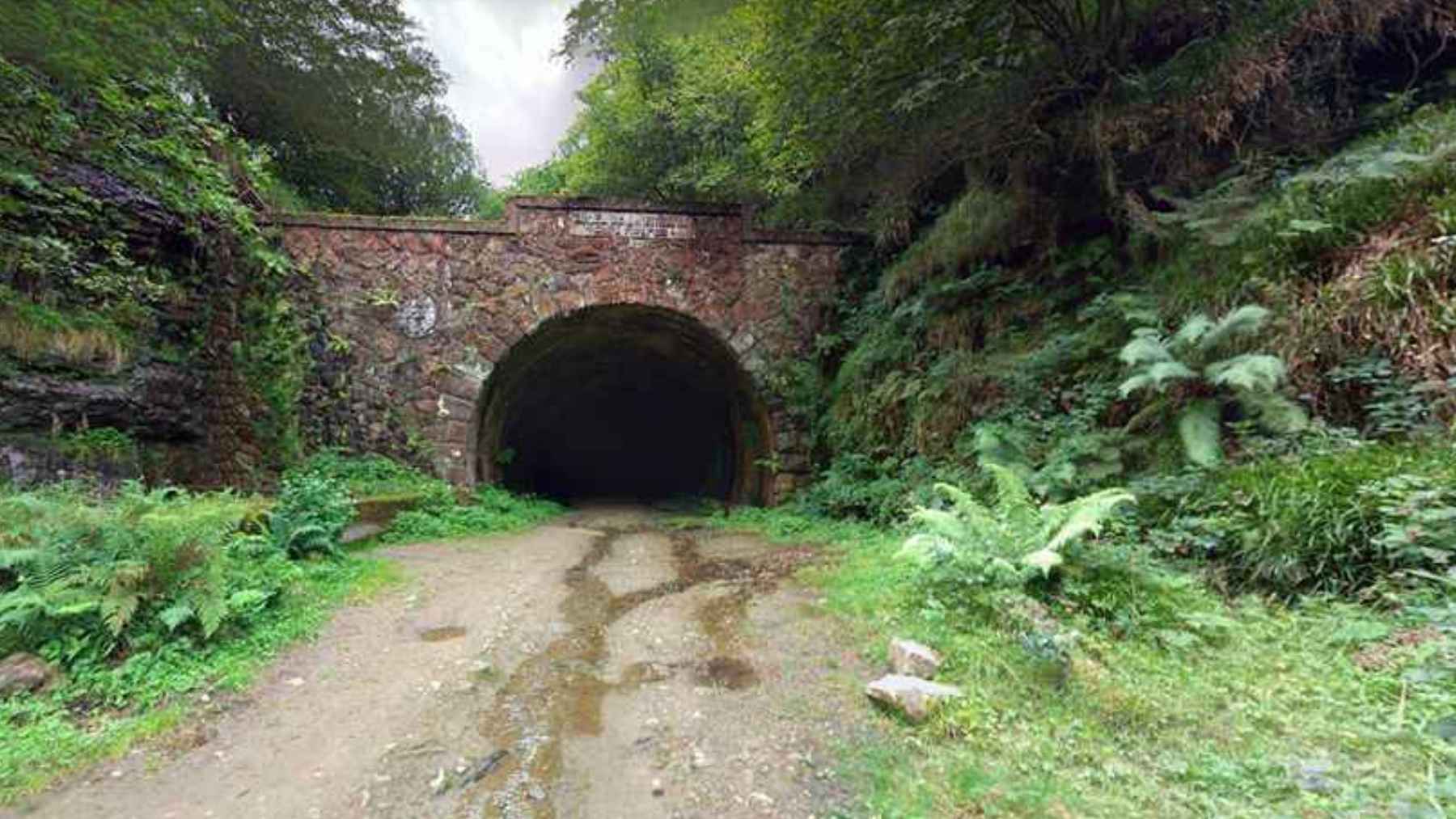 The reopened entrance of the historic La Engaña rail tunnel in Cantabria, Spain, featuring new road access and tourism infrastructure.