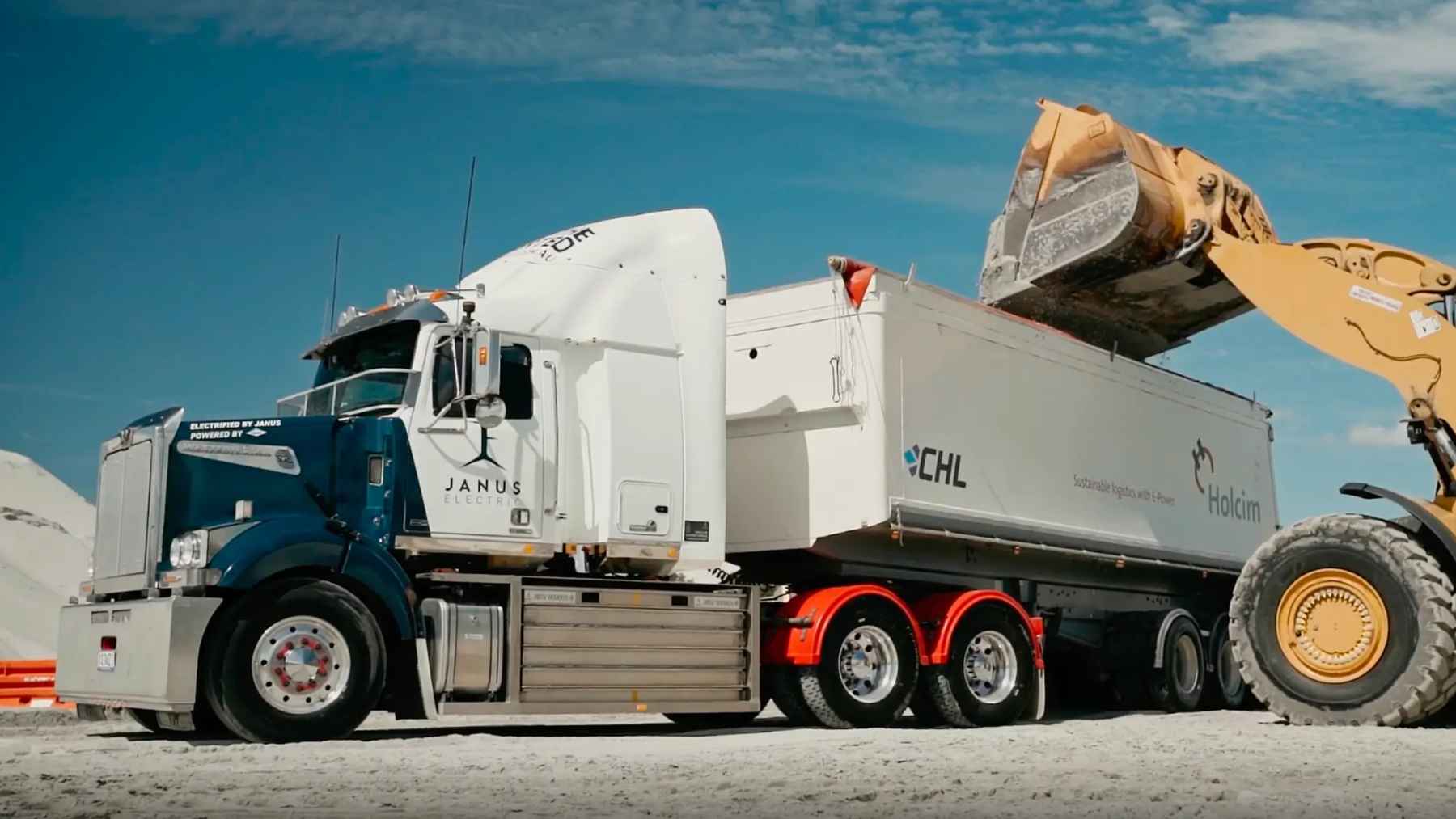 A converted heavy-duty semi-truck utilizing a swappable battery pack at an industrial freight facility.