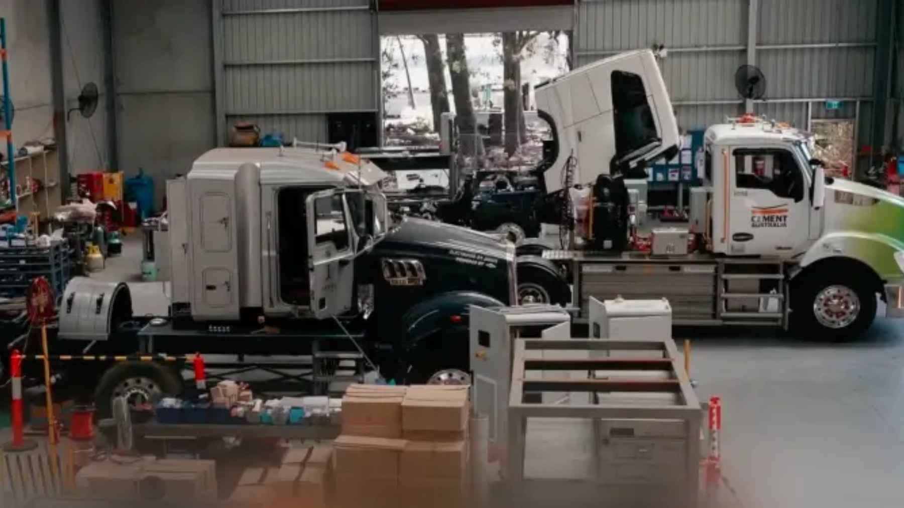 The US is converting diesel trucks to run electric with 480 horsepower and a four-minute recharge, and the battery is not bolted on 1 A converted heavy-duty semi-truck utilizing a swappable battery pack at an industrial freight facility.